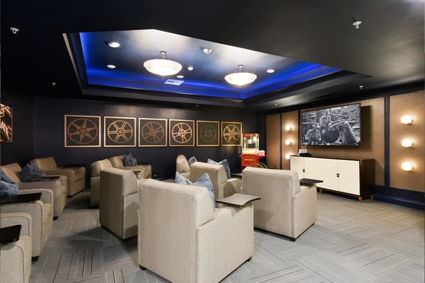 A comfortable lounge area with sofas and a large TV