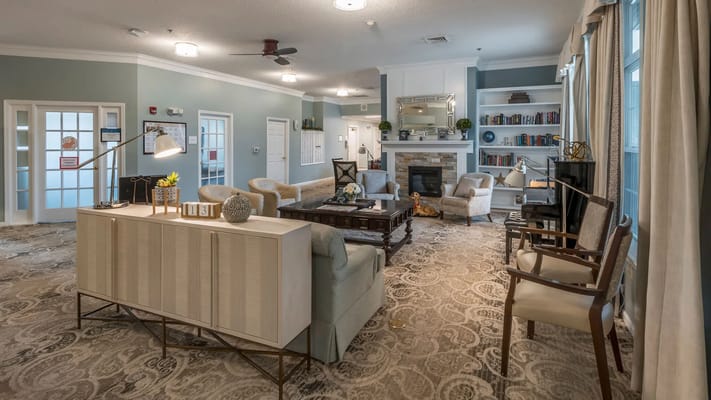 Common area with comfortable seating and bookshelves
