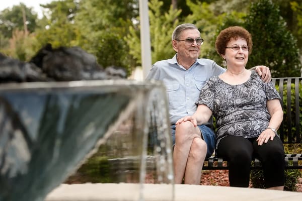 Couple enjoying time together in a garden area