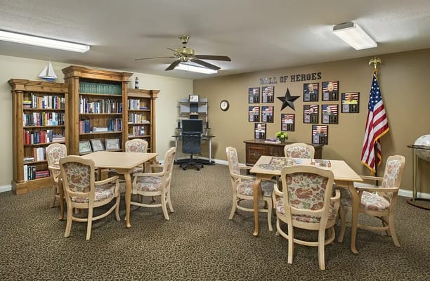 Interior common area with bookshelves and dining tables