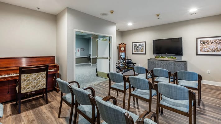 Interior common area with chairs and piano