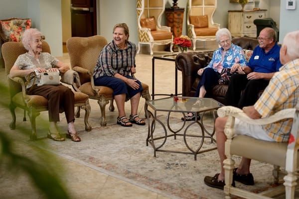 Residents socializing in a common area of the facility