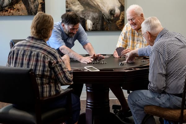 Residents playing cards in a common area
