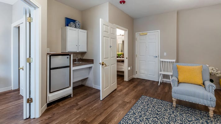 A private resident room with a kitchenette area
