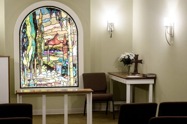 Interior of a chapel with stained glass window