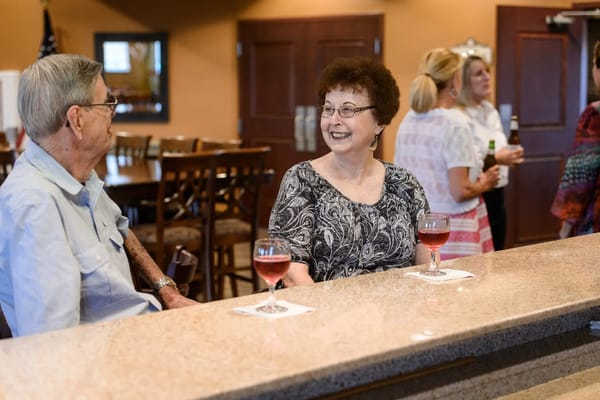 Residents enjoying drinks in a common area