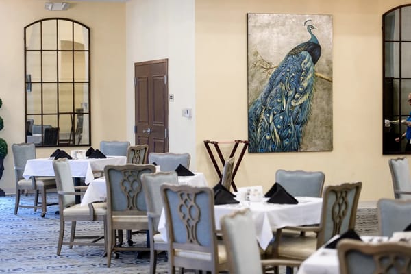 Interior dining area with peacock artwork