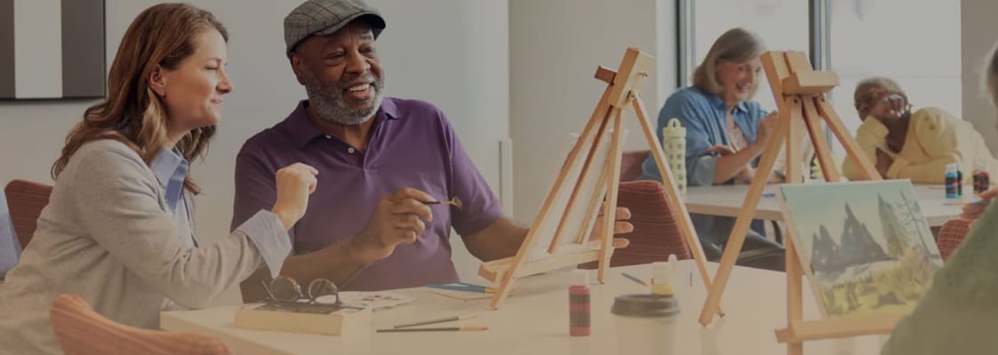 Residents painting during an art activity session