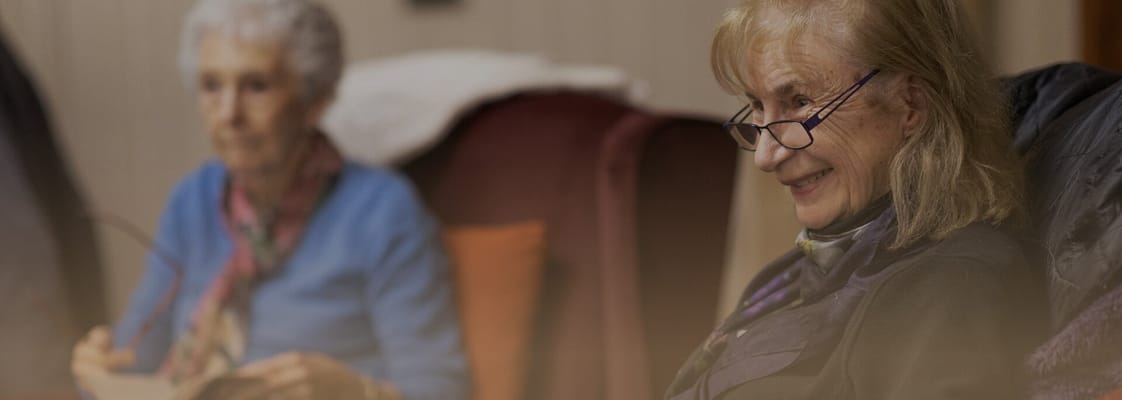 Residents engaging in a cozy indoor setting