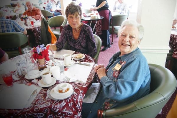 Residents enjoying a meal in a dining room