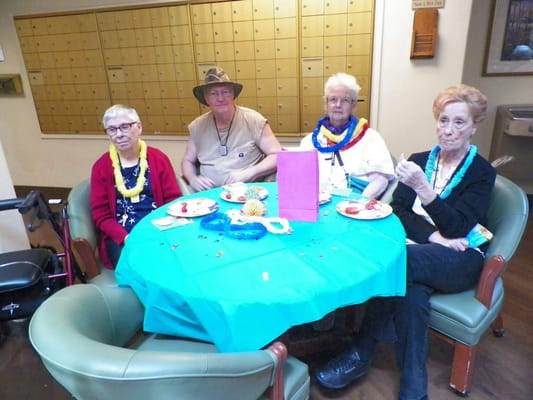 Residents enjoying a celebration at a dining table
