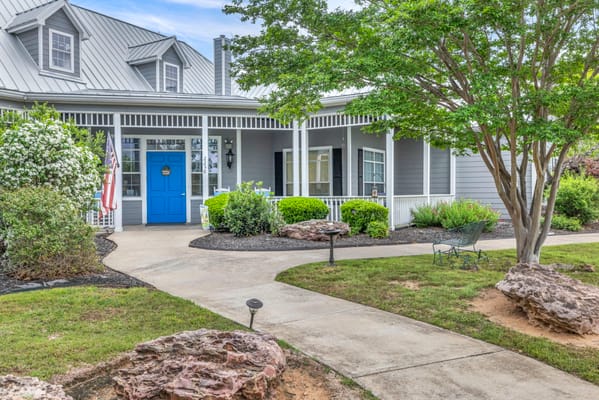 Exterior view of the facility entrance with landscaped grounds
