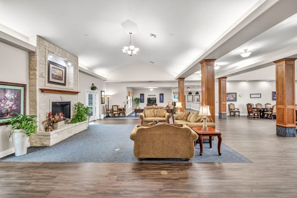 Spacious common area with seating and fireplace