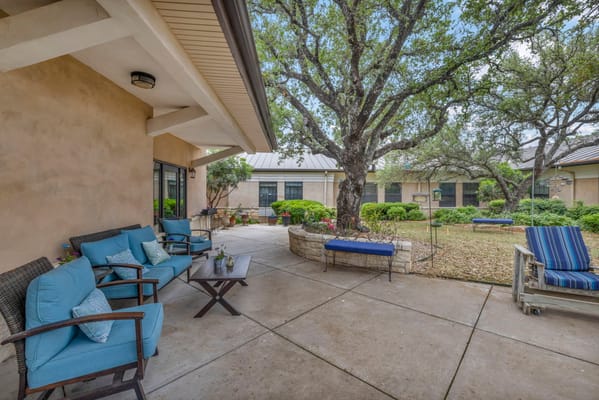 Outdoor space with patio furniture and garden area
