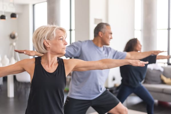 Residents participating in a group exercise class indoors