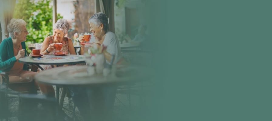 Residents enjoying tea together in an outdoor setting