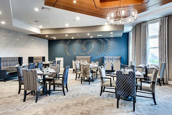 Elegant dining room setup with tables and chairs