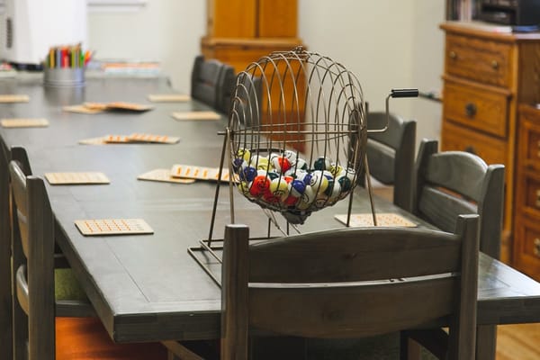 Bingo setup with a spinner and game cards on a table