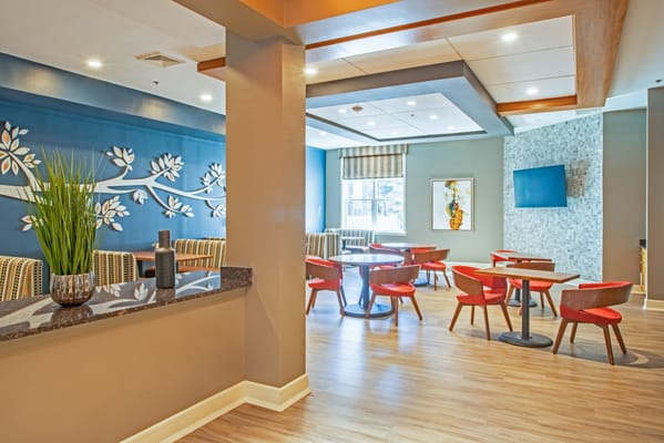 Bright interior common area with seating and decor