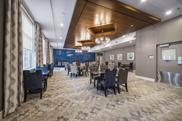 Modern dining room setup with tables and chairs