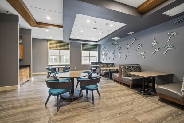 Cozy interior common area with seating and decorative wall art