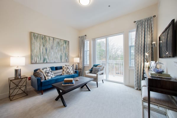 Bright living area with comfortable seating and decor