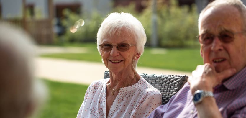 Residents enjoying the outdoors in a garden area