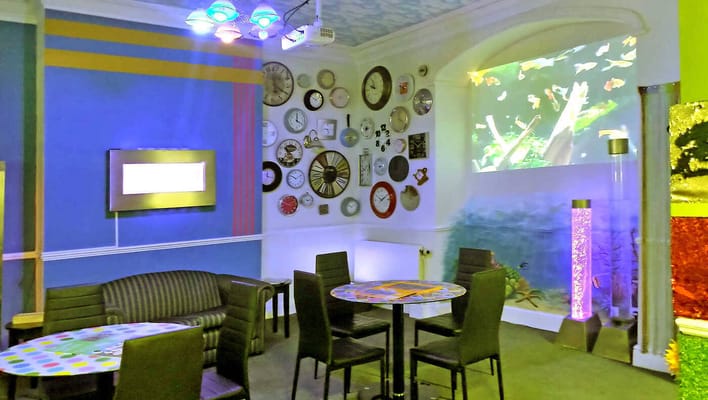 Vibrant common area with colorful decor and seating