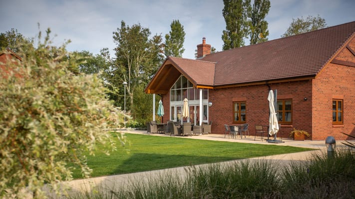 Exterior view of the facility with outdoor seating area