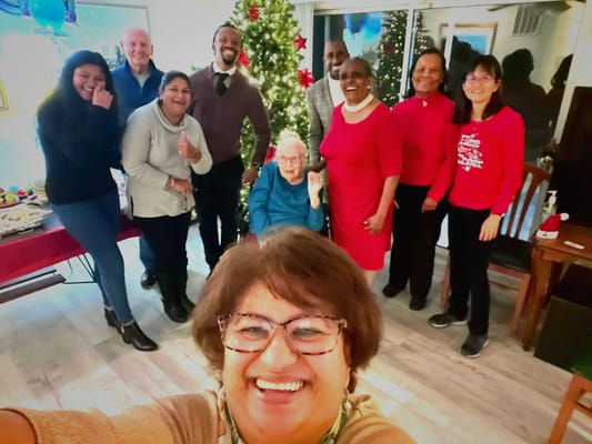 Residents and staff celebrating together during a festive event