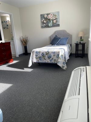 A well-furnished private resident room with decor