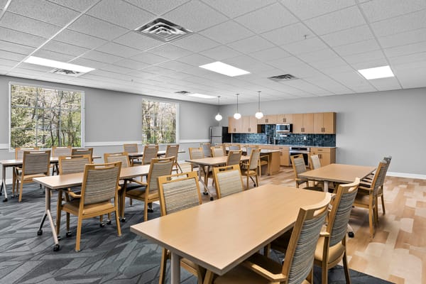 Bright common area with tables and chairs