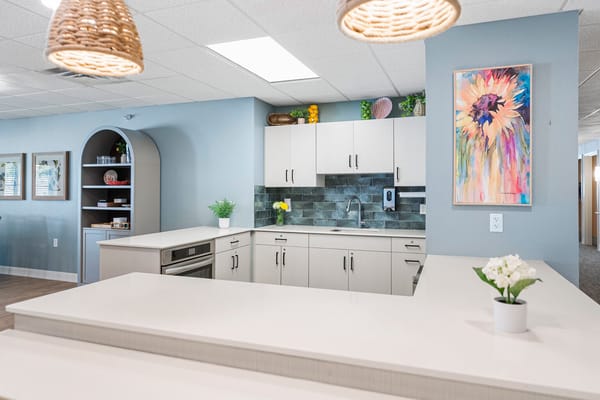 Bright kitchen area with modern decor and seating