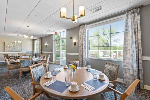 Bright dining area with tables set for meals