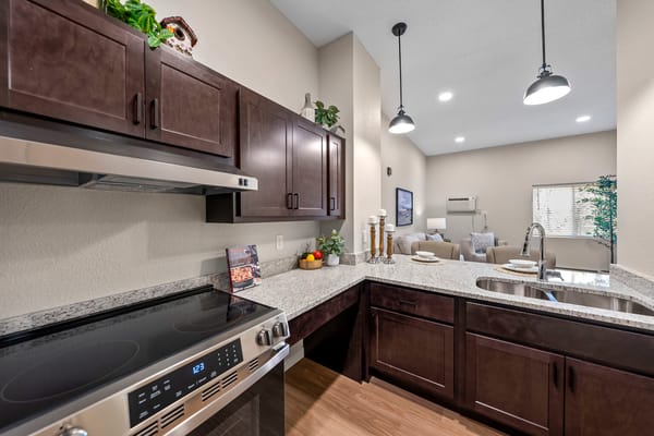 Modern kitchen interior with granite countertops and appliances