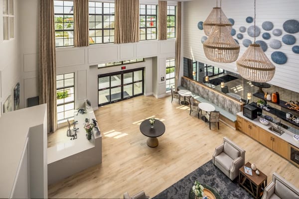 Bright interior common area with seating and decor