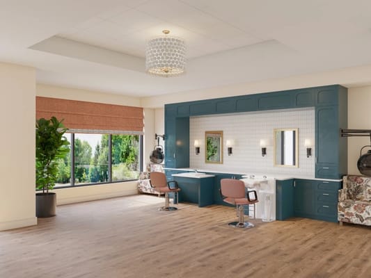 Interior of a modern hair salon with chairs and windows