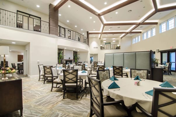 Elegant dining area with tables set for residents