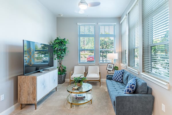 Bright common area with seating and television.