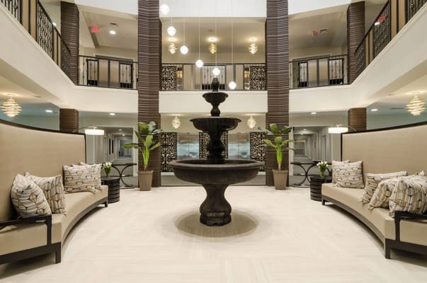 Interior lobby with a fountain and seating area