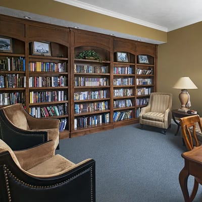 Cozy reading area with bookshelves and seating