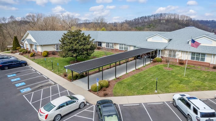 Aerial view of the facility with outdoor space and parking
