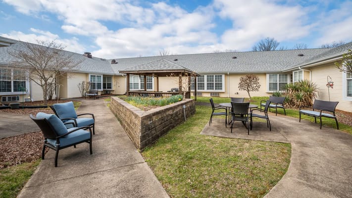 Outdoor seating area with garden in the facility