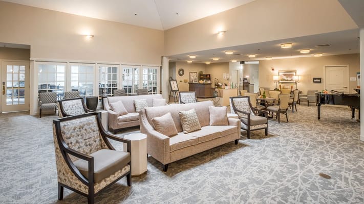 Lounge area with seating in a well-lit common space