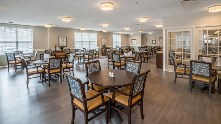 Bright dining area with tables and chairs