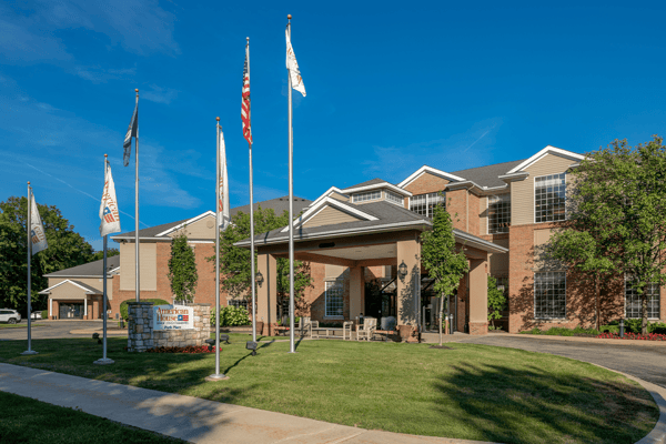 Exterior view of American House Park Place with flags