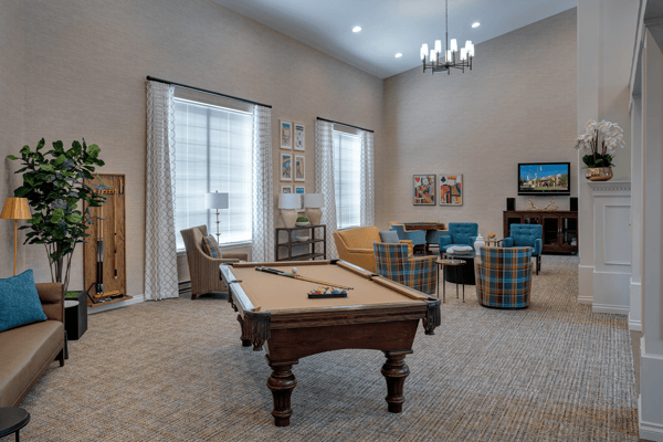 Common area with seating and a pool table