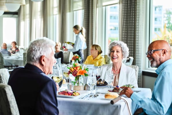 Residents enjoying a meal in the dining room