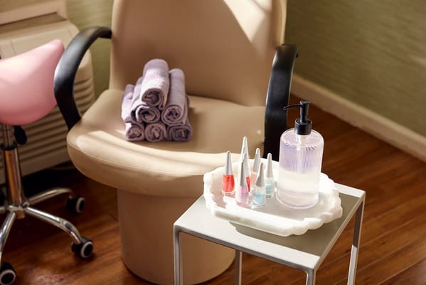 Salon setting with nail polish and towels