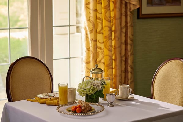 A beautifully set dining table with breakfast